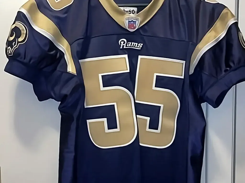 Sell vintage sports memorabilia in San Antonio Tx — Authentic Los Angeles Rams number 55 NFL game jersey on a hanger