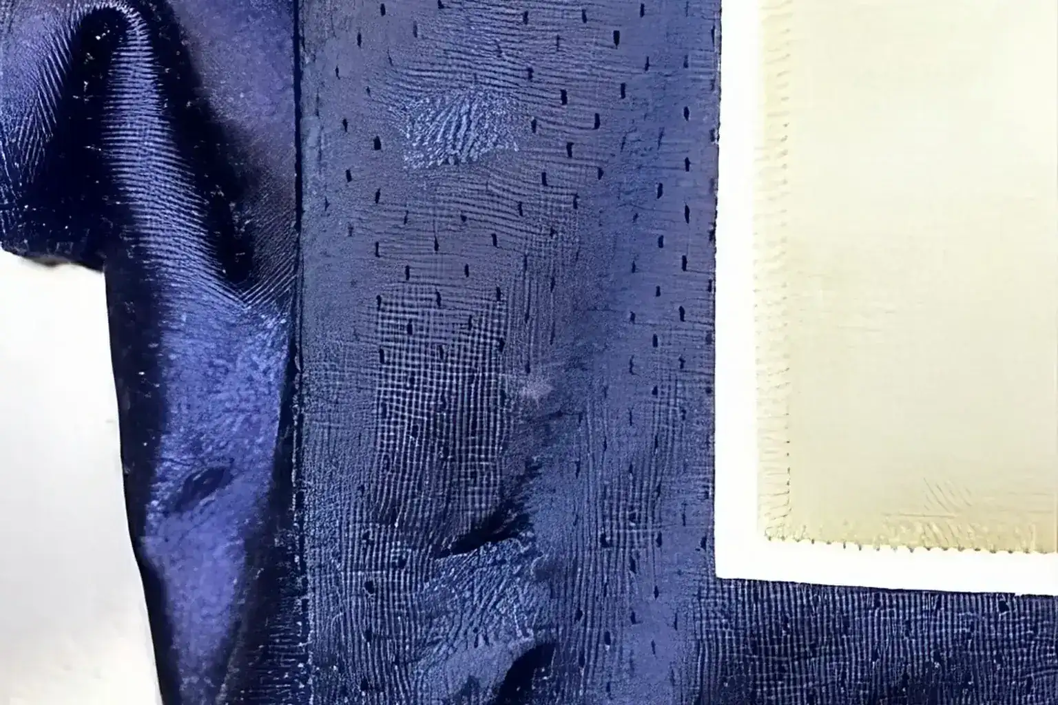 Vintage baseball glove — Close-up of navy jersey mesh showing fabric wear and condition detail